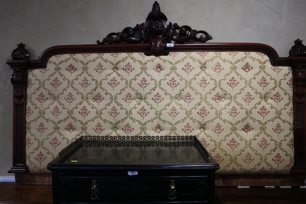 A late 19th century mahogany bed head with padded centre, 68" wide