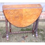 A late 19th century figured walnut oval Sutherland table, on bobbin turned supports, 24" wide