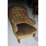 A Victorian low seat occasional chair, button upholstered in olive velour, on turned and
