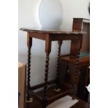 An oak drop leaf table, on barley twist supports, 30" wide, and an oak shape top occasional table,