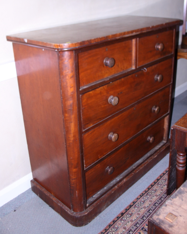 A late 19th century mahogany chest of two short and three long drawers with knob handles, on block