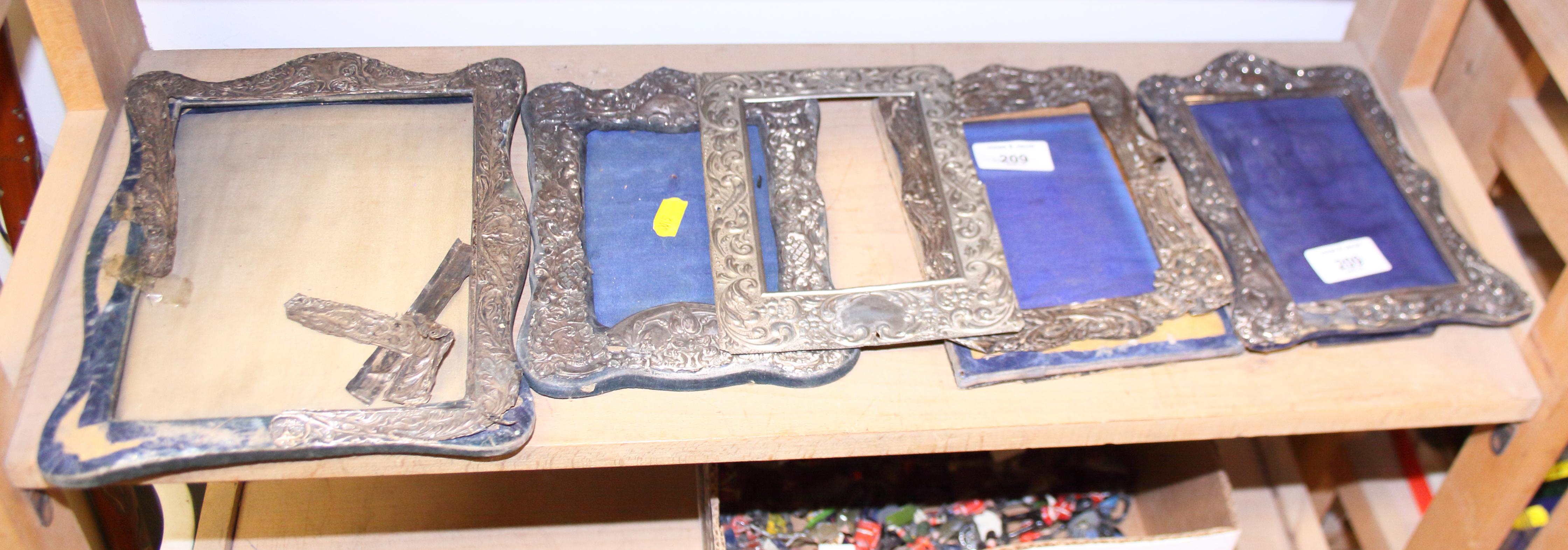 Five silver and white metal photograph frames (damages)