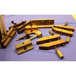 A selection of wooden moulding planes, clamps, mallets and other items