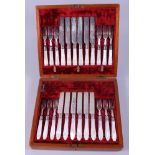 A cased set of twelve silver plated and engraved dessert knives and forks with mother-of-pearl