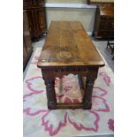 A largely 17th century refectory table with cleated plank top over arcade carved frieze rails and