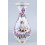 A late 19th century Continental porcelain vase with cupid and flower decoration, 13" high