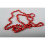 A graduated coral bead necklace, 30'' long