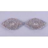 A pair of Chinese silver dishes of Rococo form with pierced and embossed dragon and prunus