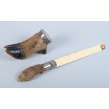 A silver mounted deer hoof vesta / snuff mull and a silver mounted ivory and fox foot page turner