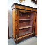 A late 19th century figured walnut, inlaid and gilt brass mounted pier cabinet enclosed glazed door,