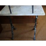A marble top conservatory table, on black cast iron support, top 16" x 30"