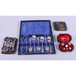 A gentleman's cased set of rolled gold shirt studs, a cased set of silver plate spoons and sugar