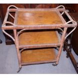 A 1930s rattan three-tier service trolley, 30" wide