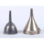 A silver hip flask funnel and a smaller, similar, silver plated funnel