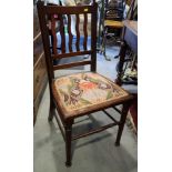 An Arts & Crafts walnut side chair with weaved splat back and padded seat and a walnut 'X' frame
