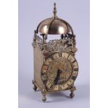 A brass lantern clock with a French carriage clock movement, 9 1/2" high