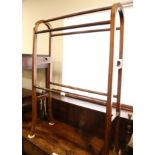 An Edwardian mahogany and line inlaid towel rail, 25 1/2" wide, and an Edwardian polished as