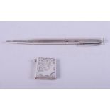 A silver pencil and a silver stamp case