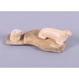An Inuit marine ivory carving of two walruses, 4 1/2" wide