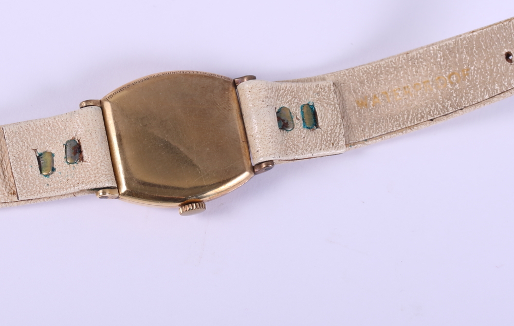 An 18ct gold wristwatch with Arabic numerals, on cream leather strap with rolled gold clasp - Bild 3 aus 4