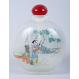 A Chinese reverse painted glass snuff bottle, decorated figures in landscapes, 5" high