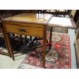 An Arts & Crafts mahogany and inlaid "work table" with glass top, pull out marble lined slide and