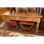 An Edwardian oak library table, fitted four drawers, on turned supports, top 36" x 60"