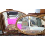 Three oval bevelled edge wall mirrors, in gilt frames, plates 34" x 22", 27" x 17 1/2" and 29" x