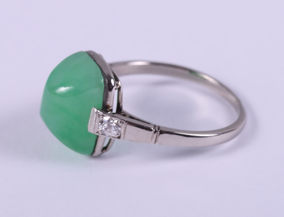 A white metal mounted jade cabochon ring, set diamonds to shoulders, ring size M/N - Image 2 of 3