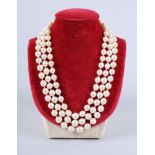 A graduated three-strand pearl necklace with 18ct white gold clasp mounted five brilliant cut