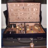 A silver mounted travelling toilet set, in morocco leather case, and a companion travel case