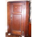 A Georgian oak corner hanging cupboard enclosed fielded panel door, 25" wide