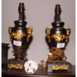 A pair of gilt metal mounted table lamps of late Georgian design, 14" high