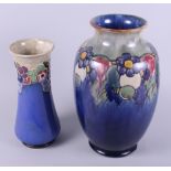 A Doulton Lambeth tube lined baluster vase, decorated fruit, 14" high, and a similar, smaller flared