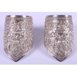 A pair of 19th century Chinese solid silver wedding cuffs / bangles with embossed floral decoration,