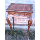 A Louis XVI design rosewood and kingwood bonheur de jour with mirror and shelf inside and brass