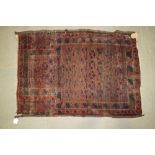 A Bokhara prayer rug on a black ground, 46" x 32" approx (worn) and two other prayer rugs, 58" x 38"