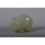 A pale celadon caved pig, 1 1/4" long