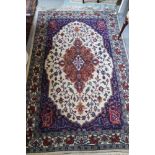 A modern Persian rug of traditional design on a fawn ground, 82" x 54" approx