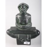 A Scandinavian seated figure, with runic inscription, 10" high (chips)