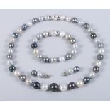 A suite of jewellery comprising a South Sea pearl necklace, earrings and bracelet with 18ct white