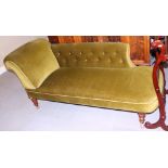 A late Victorian chaise longue, upholstered in a green velvet, on turned supports with later