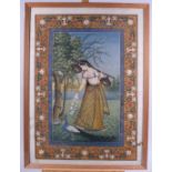 An Indian bodycolour, musician in a garden with a peacock, 21 1/2" x 15", in strip frame