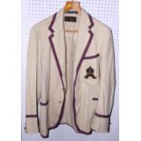A cream blazer with purple trim and RCS crest