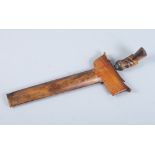 An Indonesian kris with hardwood scabbard and handle, blade 8" long