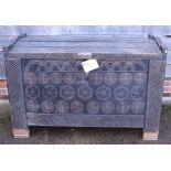 A Hungarian ebonised geometric carved beech marriage chest, on stiles supports, 55" wide