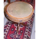 An oak circular occasional table, on four turned supports, 18" wide, and a polished as mahogany drum