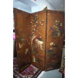 A mid 19th century decorated leather three-fold screen with pheasants, birds and water lilies,