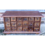 A hardwood spice chest of eighteen drawers, 25 1/2" x 13 1/2"