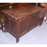 An 18th century oak triple panel front coffer, on stile supports, 48" wide